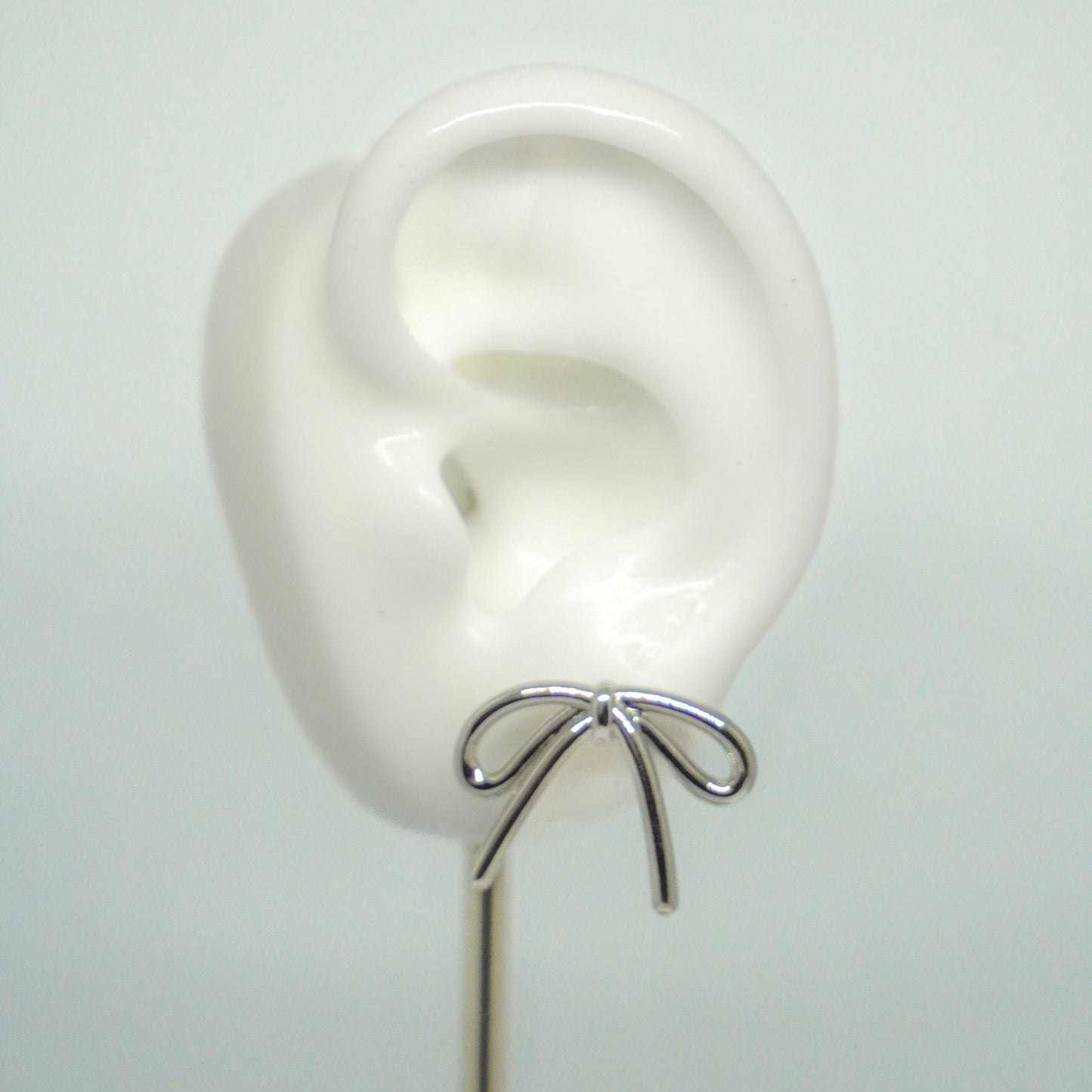 Arete moño plateado
